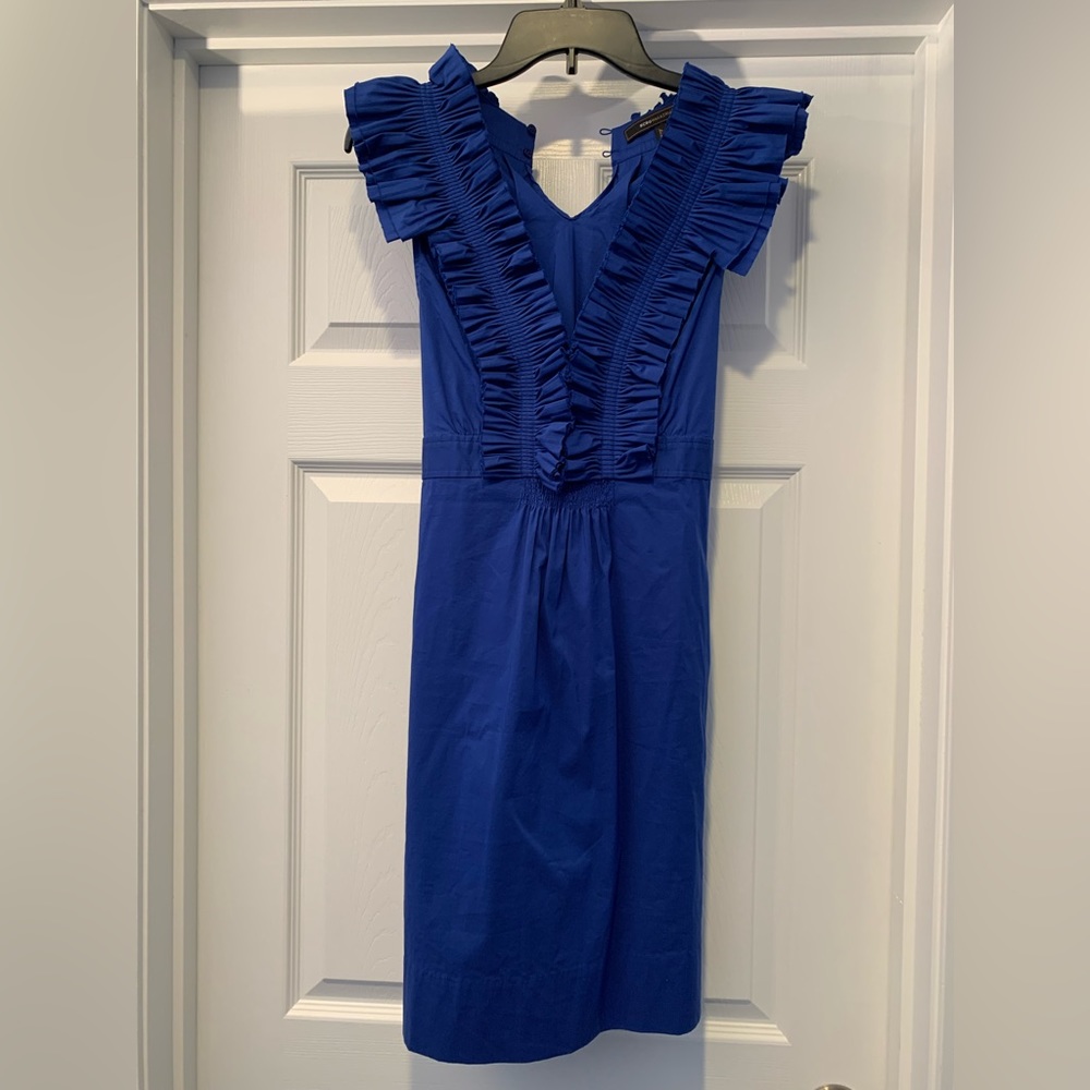 BCBG size 10 deep blue ruffle top dress. Tie in back. Deep V neck.